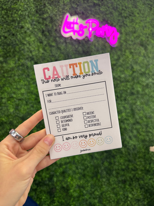 Caution: this note will make you smile notepad